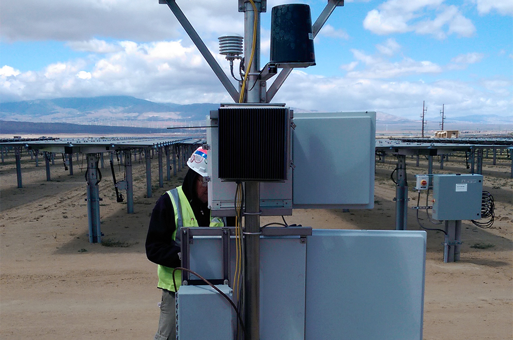 Trimax technician at solar field photo